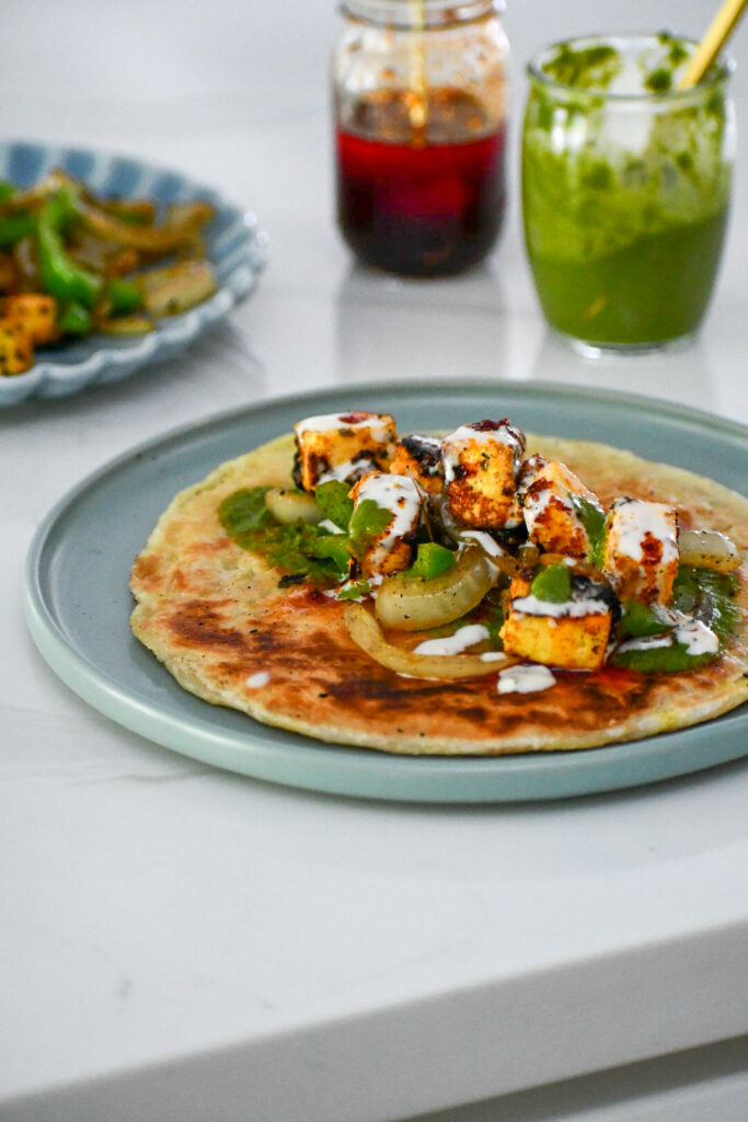 Marinated paneer is the star of the show in this spicy and flavorful Indian street food dish. A variety of chutneys, such as mint, tamarind, or cilantro, can take the chili paneer kati roll to the next level.