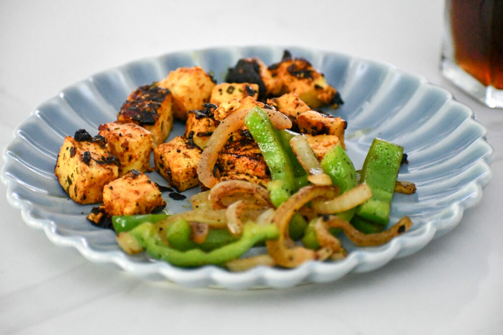 Grilled veggies add a delicious and nutritious twist to the classic chili paneer kati roll.