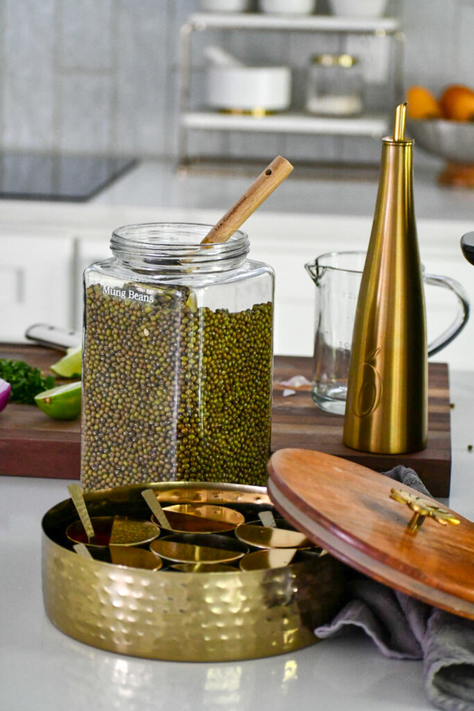glass jar filled with Indian green lentils (mung) 