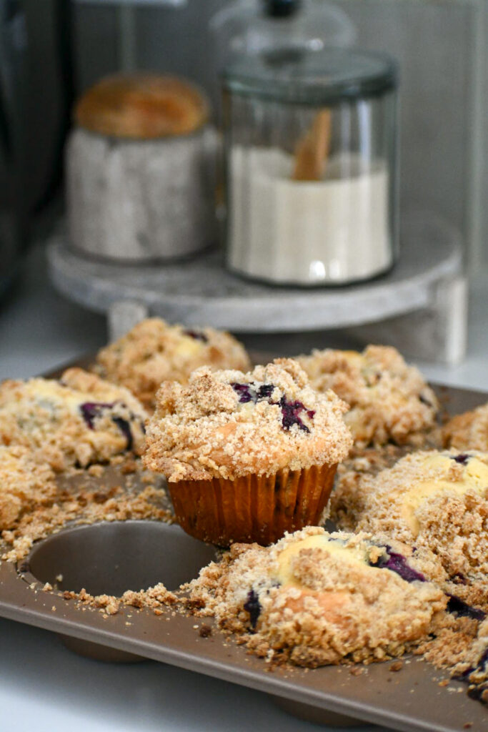 bakery-style blueberry muffins, homemade blueberry muffins, easy muffin recipe, best blueberry muffins, streusel topping, fluffy muffins, egg-free muffins, how to make muffins at home, breakfast muffin recipe.